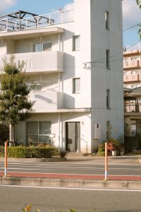 white concrete building with glass windows