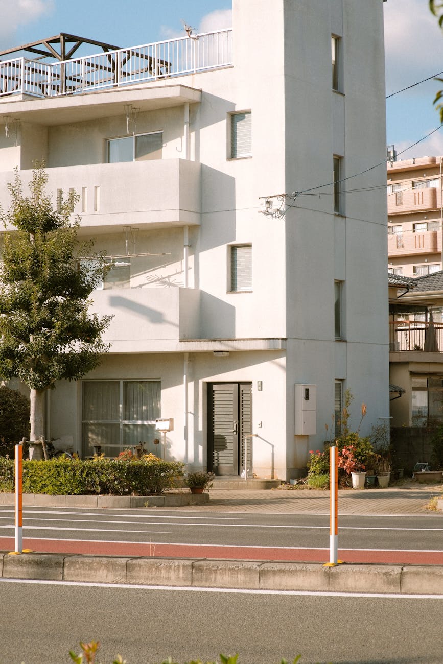 white concrete building with glass windows